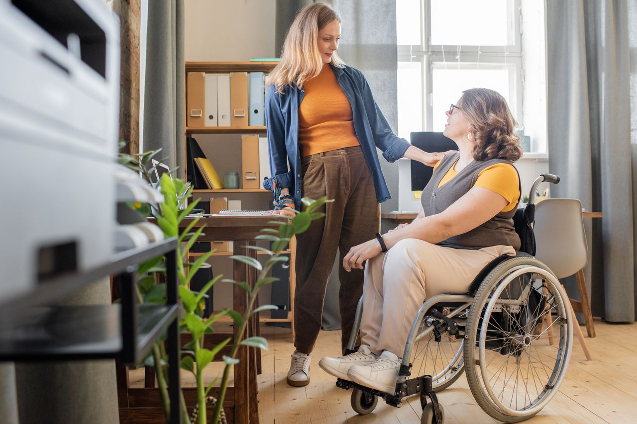 Support Coordinator Helping A Client, Illustrating The Rewarding Career Path As Part Of The Ndis.